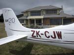 082.Colin Wade's new SR-20-G3 and his home at the Pauanui Beach airport (NZUN)
