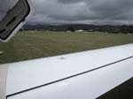 084.The Paunaui Beach airport (NZUN) runway, looking SW over the Cirrus  wing.